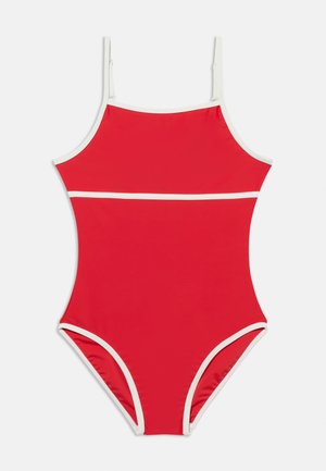 Maillot de bain une pièce rouge avec bordure blanche et fines bretelles ajustables, posé à plat sur un fond blanc.