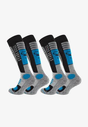 Calze al ginocchio nere, grigie e blu con motivo, dotate di talloni rinforzati, suole imbottite e strisce e pois decorativi.