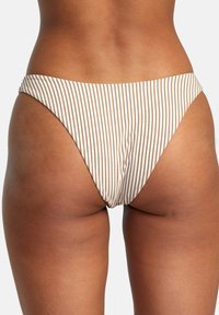 Striped bikini bottoms in beige and white. Features a high-cut design and smooth texture, with minimal rear coverage and no visible hardware.