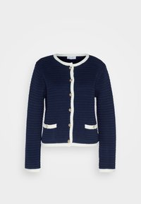 Cardigan bleu marine texturé à manches longues, avec une bordure blanche le long des bords et des poches, et six boutons dorés sur le devant.