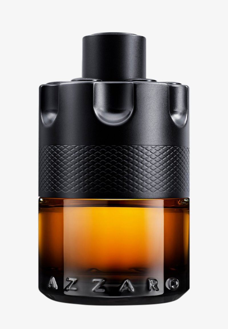 Sort og ravfarvet glas parfume flaske formet som en revolver cylinder med tekstureret greb og AZZARO branding ved basen.
