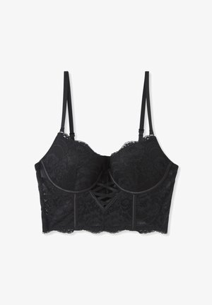 Reggiseno in pizzo nero con design strutturato, caratterizzato da un dettaglio decorativo a laccetto al centro frontale, spalline regolabili e bordi smerlati.