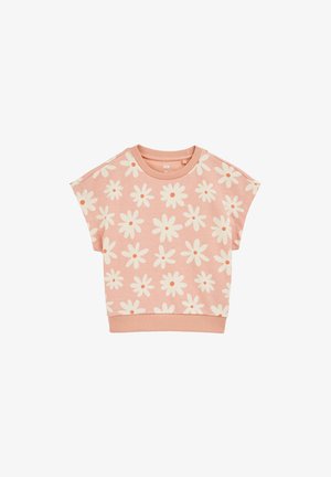 Ružičasta majica kratkih rukava s cvjetnim uzorkom u krem boji s narančastim središtima, rebrastim izrezom i rubom. Izrađena od mekanog materijala s opuštenim krojem.