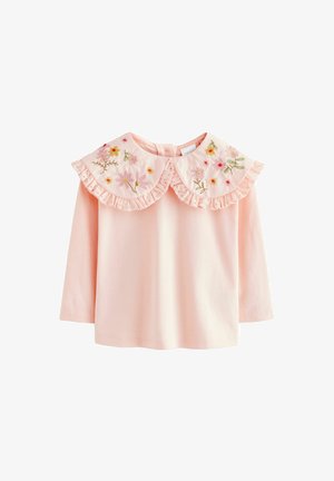 Ružová blúzka s dlhým rukávom s volánovým golierom a kvetinovou výšivkou v rôznych farbách. Mäkká tkanina s hladkým povrchom.