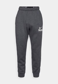 Gray sweatpants made of soft material, featuring a tapered leg, elastic waistband with branding, and a logo displayed near the hip.