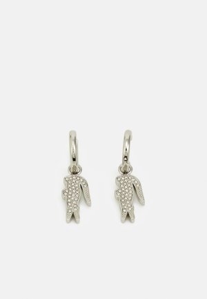 Zilveren oorbellen in de vorm van een konijn met een gestructureerd oppervlak en ingelegde rhinestones voor extra sprankeling. Lussluiting aan de bovenkant.