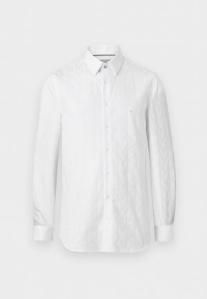 Witte lange mouwen overhemd met knoopsluiting, subtiel chevronpatroon en klein geborduurd logo op de linkerborst.