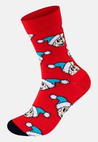Κόκκινη κάλτσα με επαναλαμβανόμενο μοτίβο από χαρούμενα σκυλίσια πρόσωπα που φορούν μπλε σκούφους του Άγιου Βασίλη με λευκή περιθώριο και πομ-πώμ, μαύρο τμήμα στα δάχτυλα.