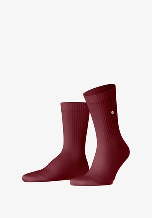 Burgundy ribbed socks with a smooth texture, featuring a contrasting logo accent. Ankle length, designed for comfort and durability.