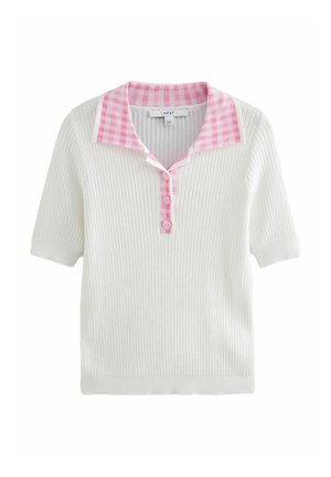 Baltas trumpomis rankovėmis megztinis polo su rožiniu tikslu apykakle ir mygtukų užsegimu. Pasižymi laisvu siluetu ir švelnia tekstūra.