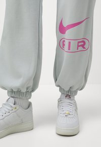 Nike Sportswear AIR JOGGER - Tracksuit bottoms - photon dust
