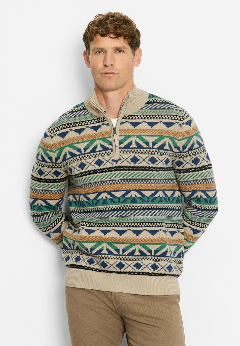 Beige Strickpullover mit einem Viertel-Reißverschluss, der mehrfarbige geometrische Muster in Grün, Blau, Orange und Schwarz aufweist. Weicher Stoff.
