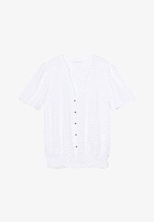 White short-sleeve cardigan with a textured pattern, five brown buttons down the front, and a gathered waist. Lightweight fabric.