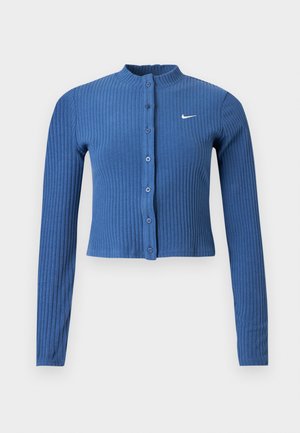 Μπλε ριμπ μακρυμάνικη κοντή ζακέτα με κούμπωμα μπροστά και λευκό λογότυπο Nike swoosh στο αριστερό μέρος του στήθους.