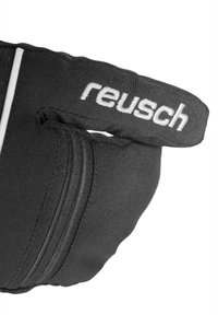 Sort handske med tekstureret stof, der har et hvidt "reusch" logo og en sikker strop. Inkluderer en lynlåslomme detalje.