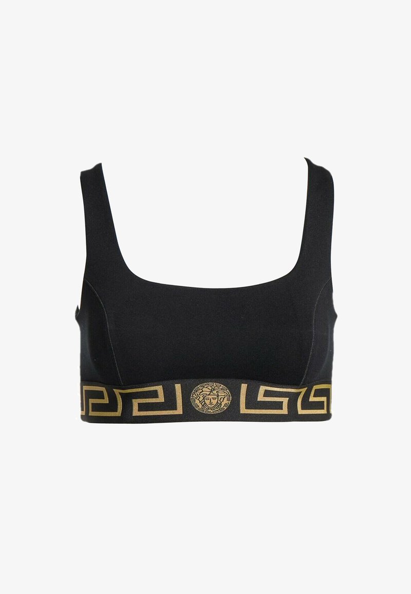 Crop top noir avec larges bretelles, motif clé grec doré et emblème tête de Méduse sur la bande élastique sous la poitrine.