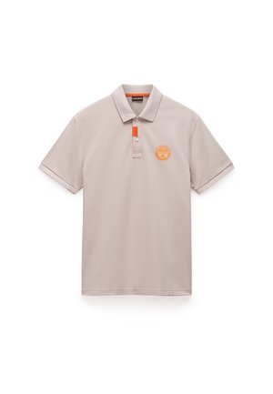 Beige polo shirt with a classic collar, featuring an orange accent on the placket and a circular logo on the left chest. Smooth texture.