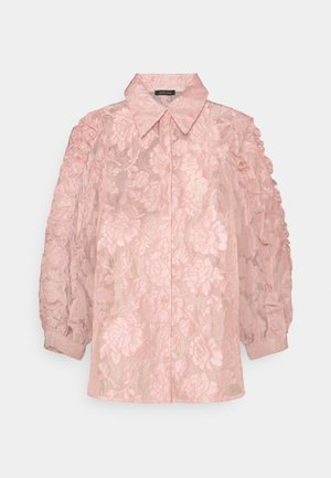 Pink long-sleeve blouse with floral lace pattern, puffed sleeves, button-down front, and wide pointed collar.