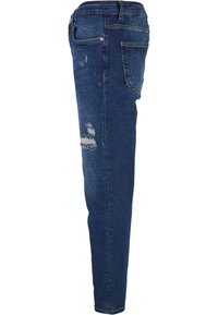 Svetle skinny kavbojke iz denima, s pošvedrano prhanjem, poškodovanjem na kolenu in standardnim petim žepom.