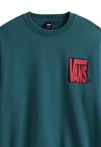 Tyrkysová mikina s kulatým výstřihem, na levé straně hrudi s červeným logem Vans. Vyrobena z měkké tkaniny s hladkou strukturou.