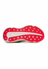 Rote und weiße Sneaker-Sohle mit einem strukturierten Muster und kreisförmigen Griffakzenten. Weiche Kanten und zentrale Rille für Flexibilität und Unterstützung.