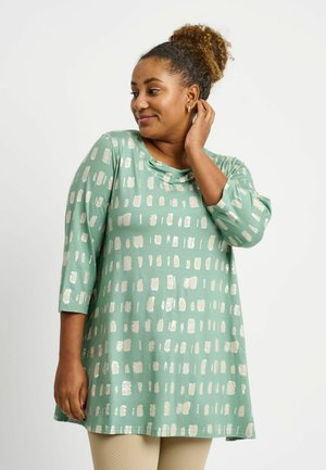 Long-sleeve mint green top with metallic brushstroke pattern, scoop neckline, and relaxed fit. Soft fabric with a smooth texture.