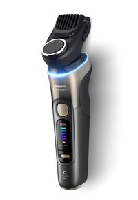 Rasoio Philips Serie 9000 Prestige Ultra in nero e argento, dotato di impugnatura testurizzata, indicatore LED della batteria e testa del rasoio regolabile.