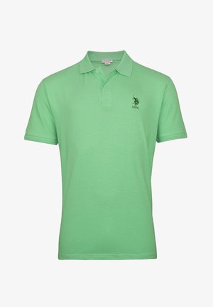 Zeleno polo majica iz bombaža, s tri gumbe na zapenjanju, kratkimi rokavi in majhnim kontrastnim logotipom na prsih.