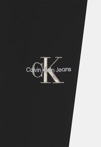Calvin Klein Jeans MONOGRAM OFF PLACED - Träningsbyxor - ck black