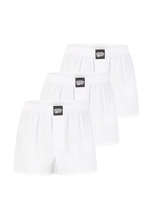 White cotton boxers displayed in a pack of three, featuring an elastic waistband and a small black logo tag at the front.