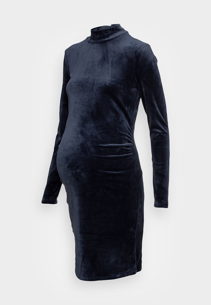 Robe de maternité à manches longues, longueur genoux, en velours bleu marine foncé, col montant et côtés froncés pour plus d’extensibilité.