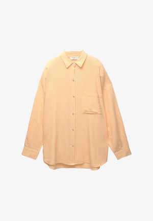 Licht perzikkleurig overhemd met knopen, een kraag, lange mouwen en een borstzak. Gemaakt van een zachte, gestructureerde stof met een relaxte pasvorm.