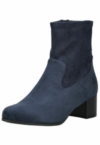 Bottine en suédine bleu foncé avec un talon compensé, texture lisse et fermeture éclair sur le côté. Bout rond et détails en panneau contrasté.
