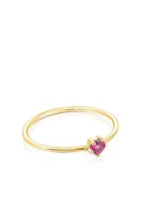 Anello d'oro con una fascia liscia e una pietra preziosa rotonda, di colore rosa, saldamente incastonata in un'impostazione a sei griffe, che presenta un design elegante.