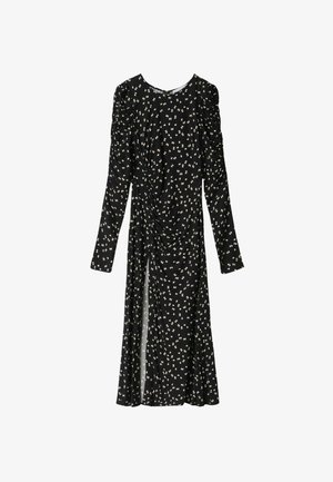 Abito nero con maniche lunghe, caratterizzato da un motivo floreale bianco, corpetto arricciato e uno spacco laterale. Tessuto morbido e leggero con vestibilità rilassata.