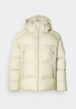 Puffy cream-colored jacket with a high collar, detachable hood, and two zippered side pockets. Textured, soft fabric with horizontal stitching.