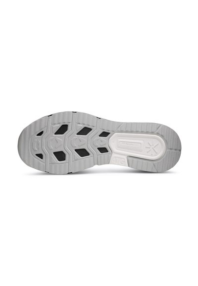 Shoe outsole featuring a textured gray rubber with black accents, a multi-pattern design for traction, and a reinforced heel section.