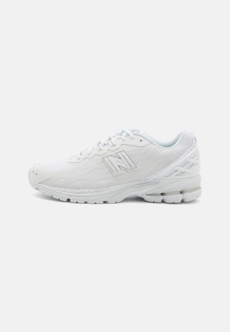 White athletic shoe featuring mesh upper, textured details, and a cushioned sole. Reflective accents and logo on the side. Lightweight design.