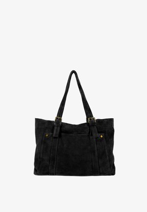 Sac cabas en daim noir avec deux longues poignées, poche avant et détails de boucle en laiton sur fond blanc.