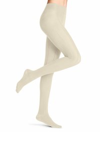 Collants beige tricotés avec un motif texturé, présentant un détail de couture surélevée sur le côté et une taille lisse.
