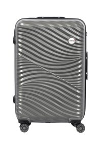 Hard-shell suitcase in textured gray plastic with wave pattern, black zippers, a side handle, and four swivel wheels for mobility.