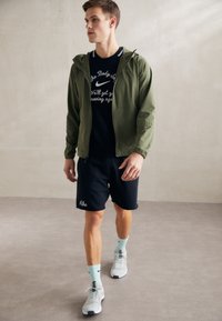 Nike Performance UNLIMITED - Trainingsjacke - medium olive/black