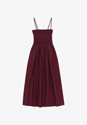 Bordeaux maxi kjole med smocket bodice, tynde justerbare stropper og en flydende plisseret nederdel. Lavet af letvægts bomuldsstof.