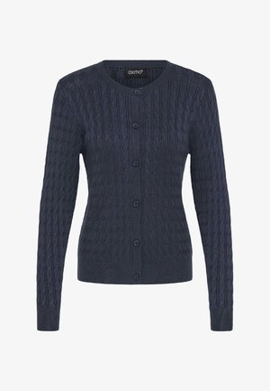 Tumši zilas krāsas adīta džemperi ar reljefa kabeli, apaļu apkakli, garām piedurknēm un sešiem pogu aizdares elementiem.