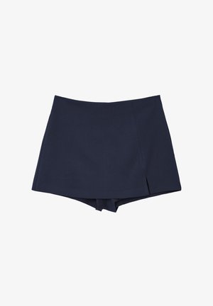 Jupe-culotte bleu marine avec un devant croisé et une longueur courte, présentant une petite fente sur le côté droit.
