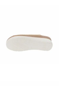 Semelle en liège avec un dessus en tissu beige, présentant une semelle extérieure en caoutchouc blanc avec une adhérence texturée et un design de bout arrondi.