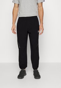 Reebok Teplákové kalhoty - black