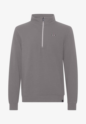 Hall hedgevil gray pullover-sweater, millepuudega ja veerandi lukuga kaelusega, pikkade varrukatega, ning rinnal on väike logo punaste, valgete ja siniste triipudega.