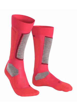 Calzini rosa brillante con accenti grigi, caratterizzati da pannelli testurizzati per grip e flessibilità. Cuffia a coste per una vestibilità ottimale, lunghezza a metà polpaccio.