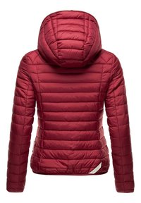 Red puffer jacket with a hood, featuring vertical quilted sections and a smooth texture. Includes a small logo accent on the hem.
